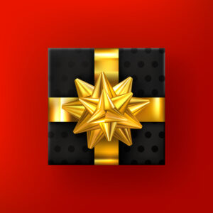 Geschenk mit goldenem Band auf rotem Hintergrund